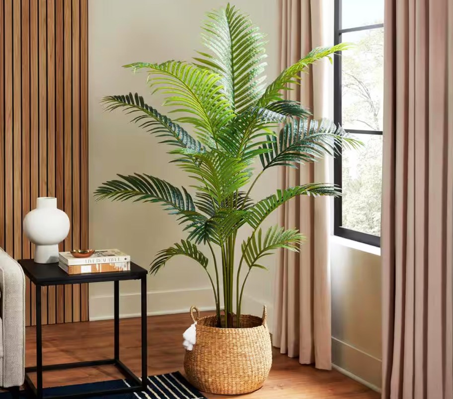 green faux palm tree in basket in living room