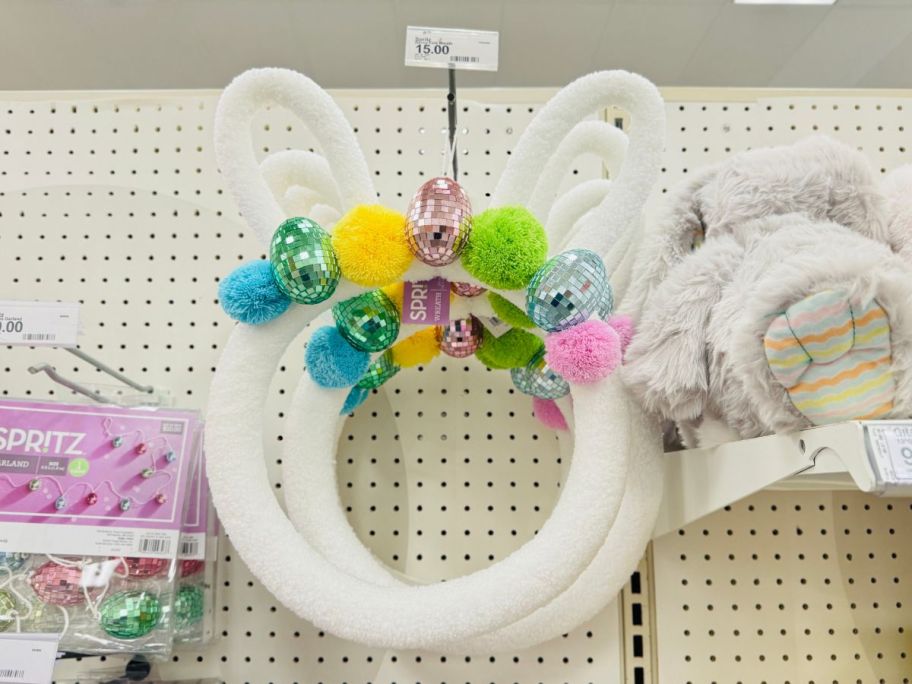 Spritz 18" Bunny Ears Easter Wreath hanging in store