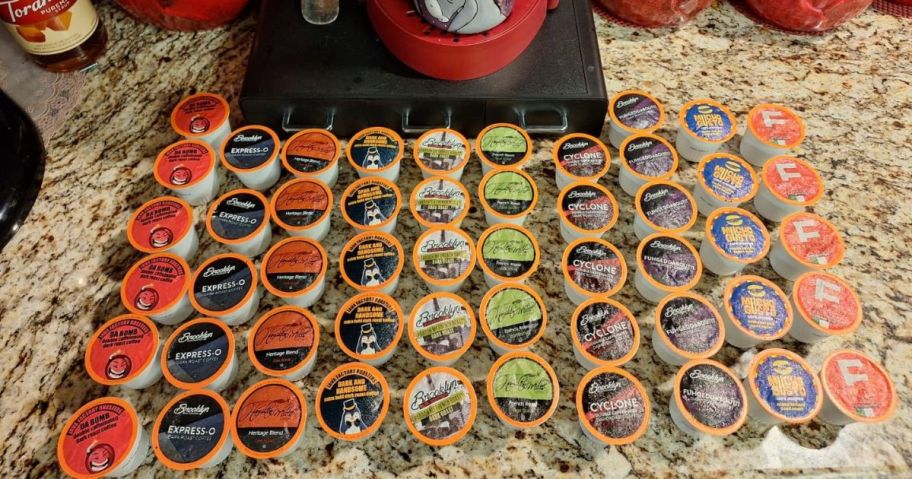 40 K-Cups on a counter in front of a Keurig