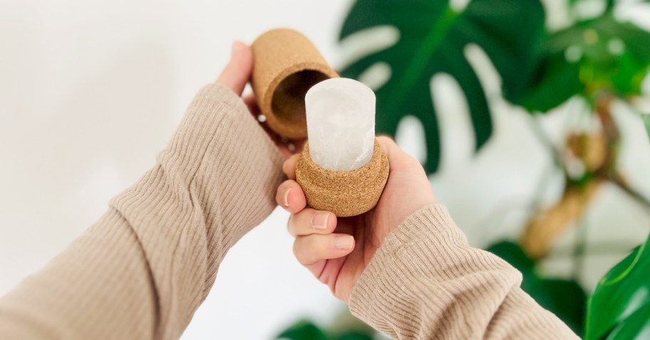 hand holding crystal deodorant stick