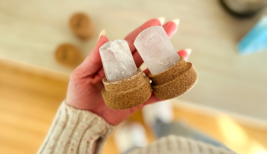 hand holding two crystal deodorants 