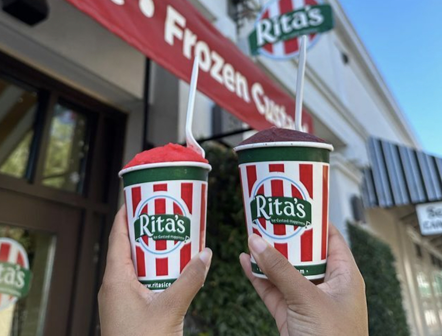 two hands holding up a rita's italian ice what to buy in march