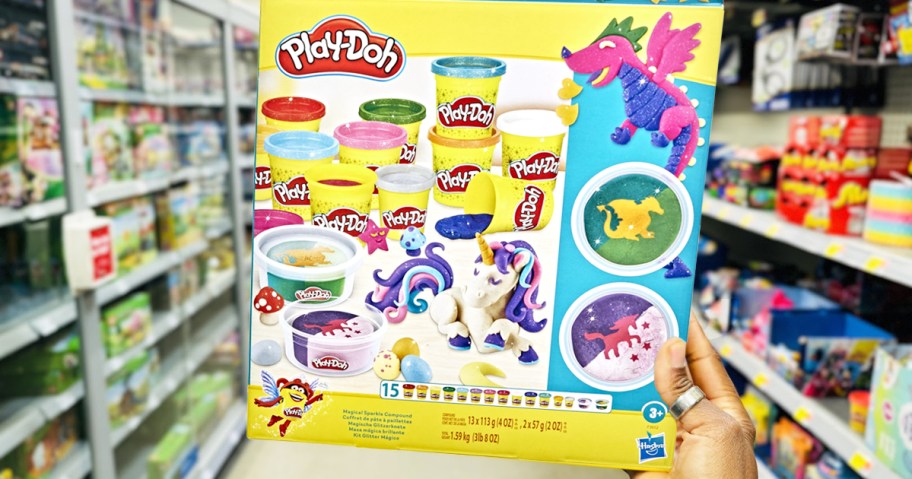 hand holding a play-doh sparkle set in store