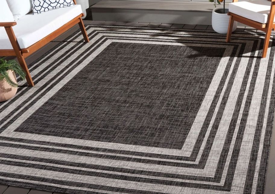 a brown and beige geometric outdoor rug