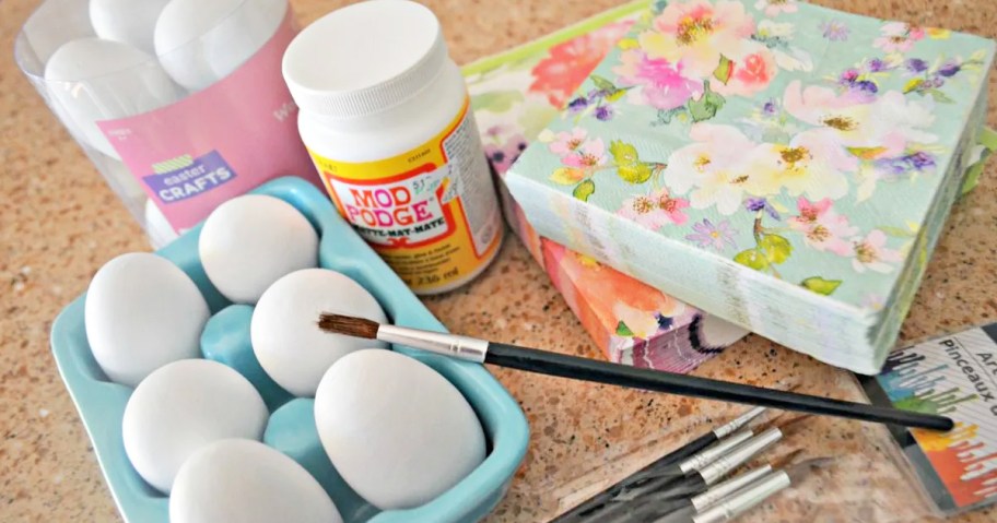 eggs with crafting supplies on kitchen counter