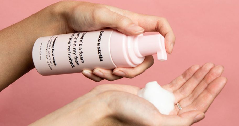 grace & stella foaming cleanser being pumped onto a woman's hand
