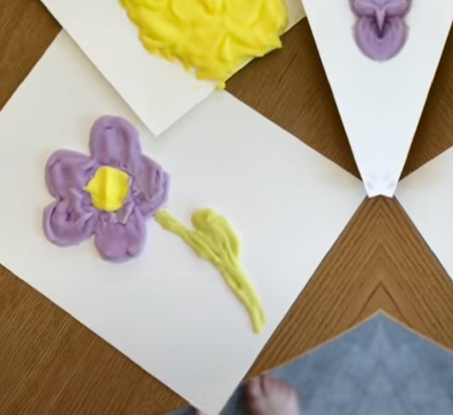 flower of purple puffy paint made out of shaving cream