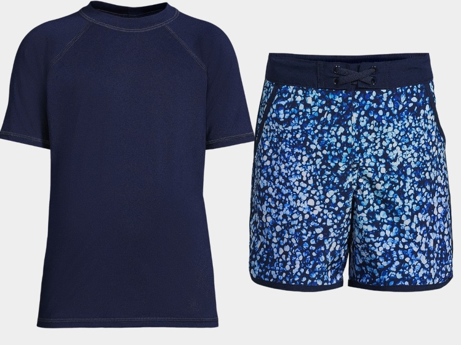 a blue rash guard shirt and blue pattern swim trunks