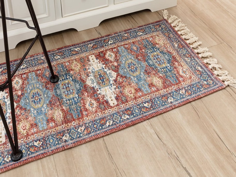 patterned runner rug on light wood floor