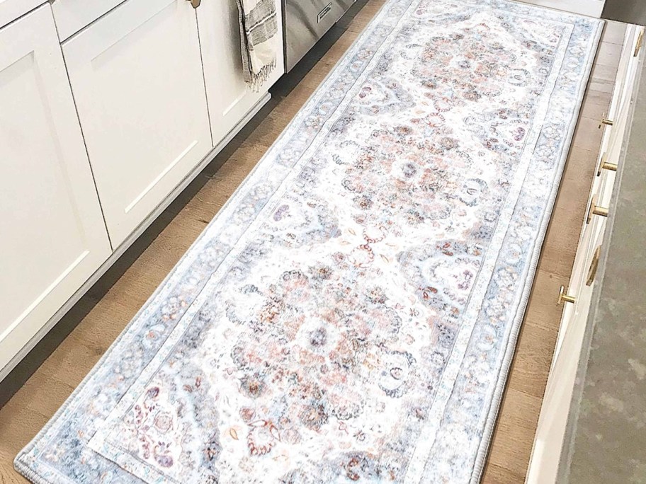white runner rug on light wood floor