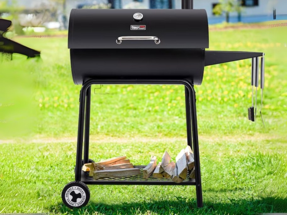 a small black grill in a backyard