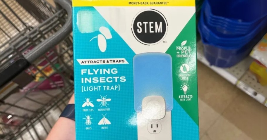 hand holding a box with a STEM Flying Insect Light Trap Starter Kit 