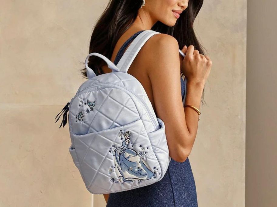 Woman wearing a Disney Vera Bradley Cinderella Small Backpack Bag