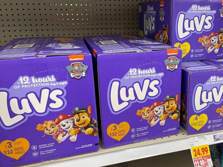 boxes of luvs diapers on shelf at store