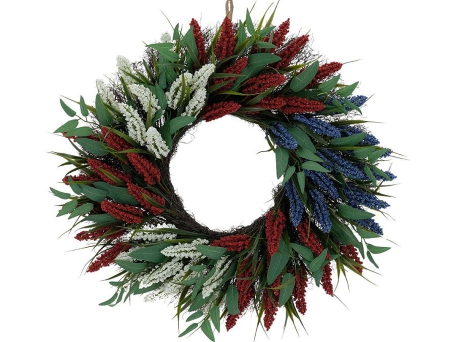 a floral green, red, white, and blue wreath