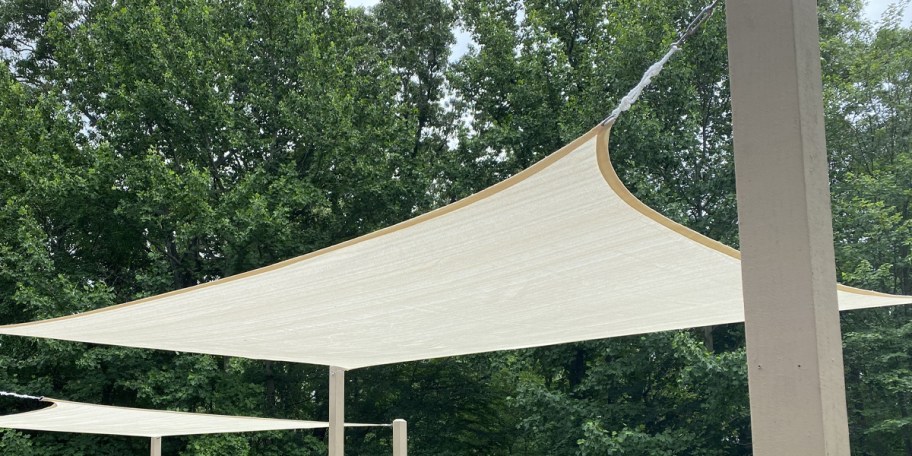 tan sunshade hanging outdoors