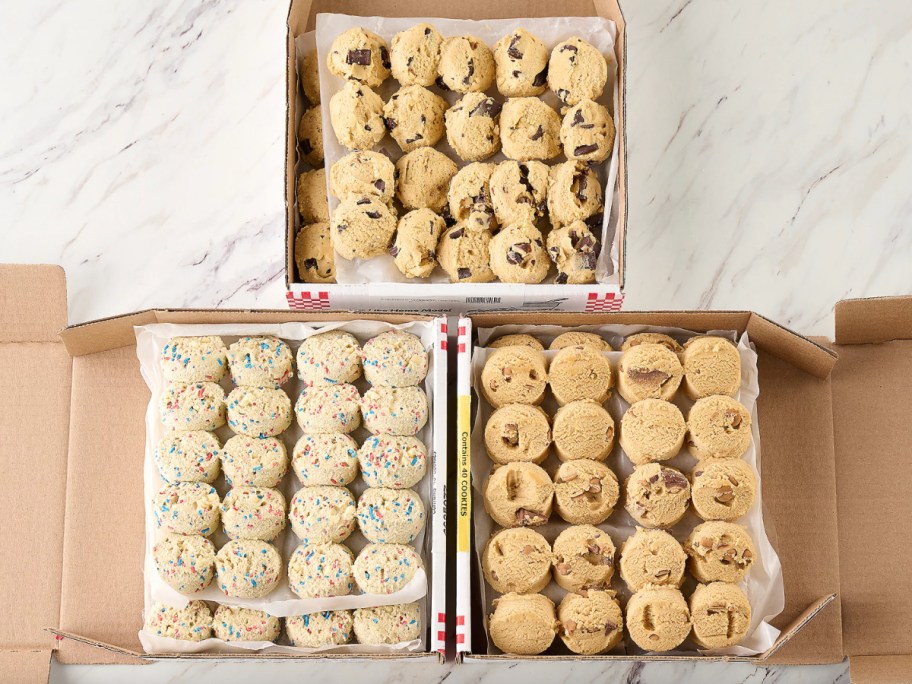 three boxes of cookie dough balls