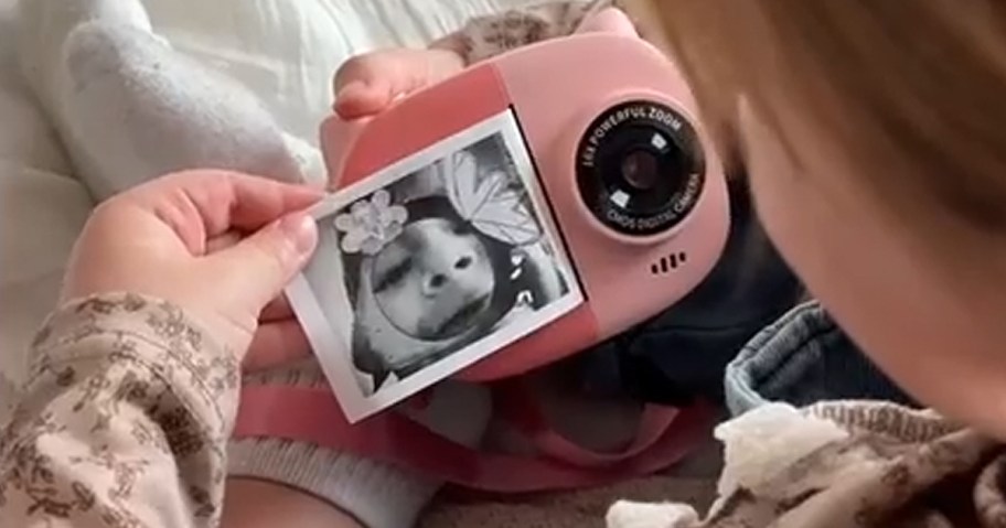 child using a digital camera