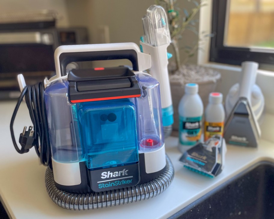 shark stainstriker w tools next to sink