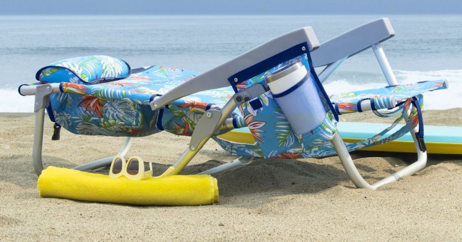 tommy bahama beach chair lying flat on the beach