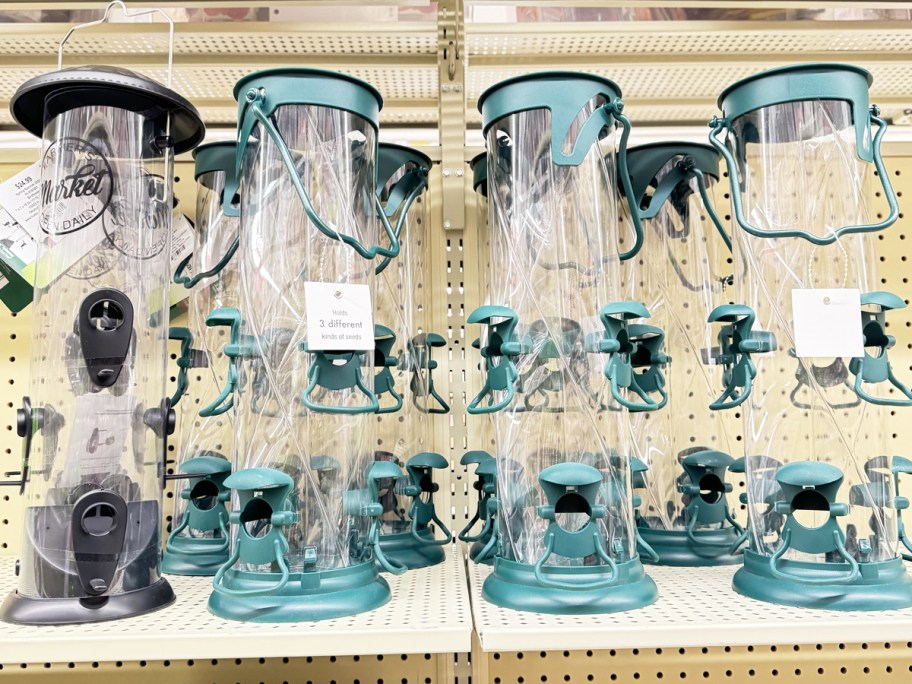 black and teal bird feeders on store shelf