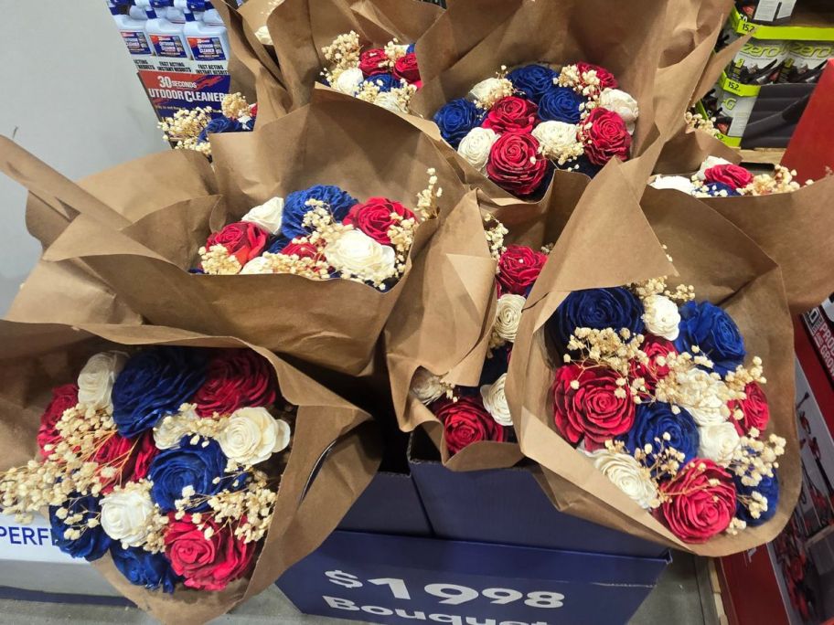 A display of Lowe's Dozen Red, White, & Blue Artificial Rose Bouquets