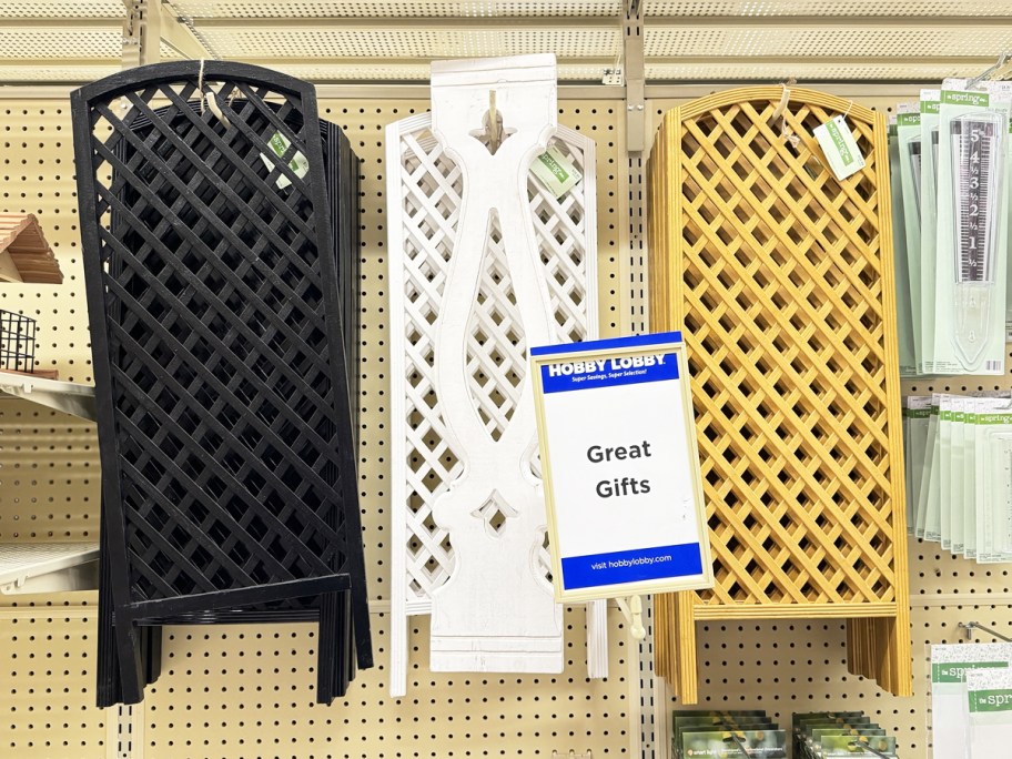 black, white, and wood lattice panels hanging in store