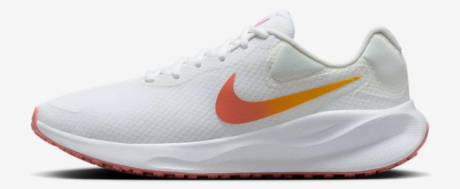 white and orange Nike Revolution 7 Women's Road Running Shoe stock image
