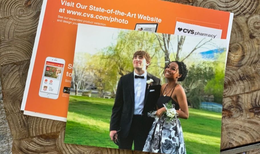 a 5x7 photo of a young couple on an orange CVS Photo envelope