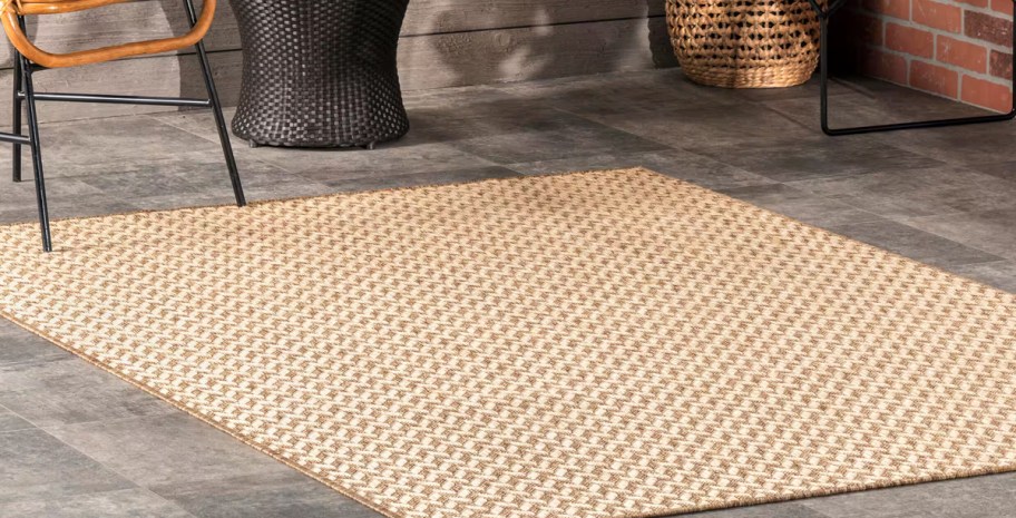 Camryn Abstract Herringbone Beige 8x10foot Patio Area Rug being used on a patio