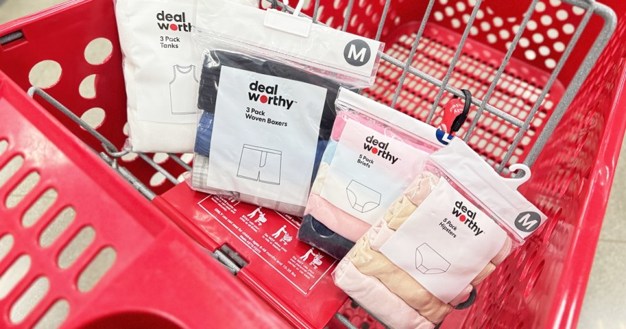 A target shopping cart with several packs Dealworthy undergarments in the front basket