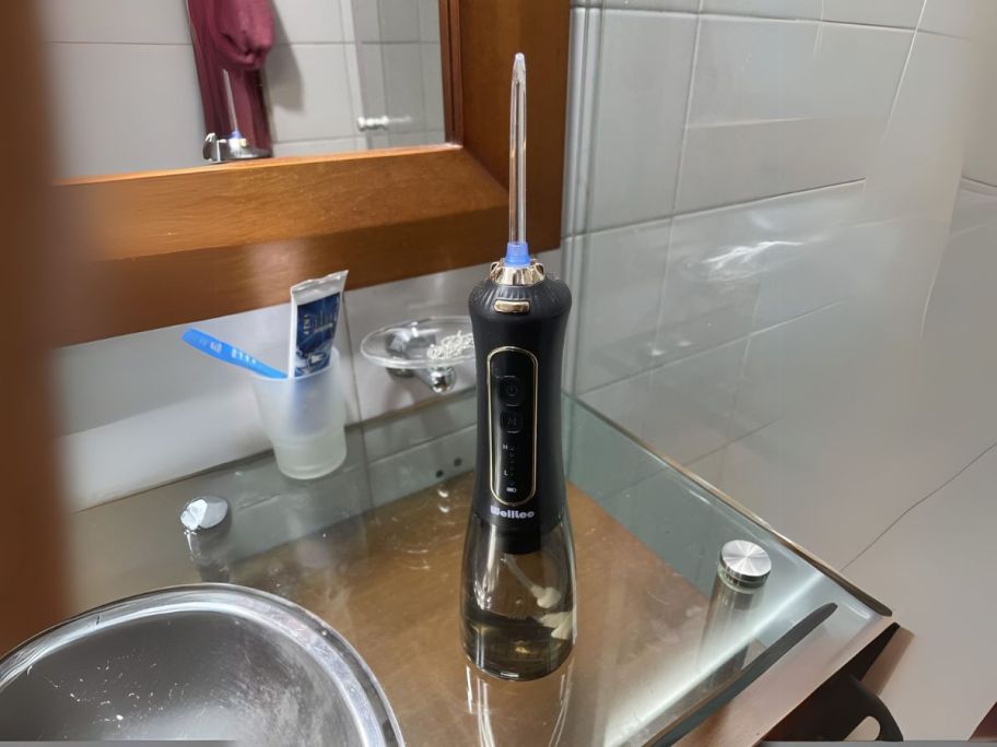 water flosser on bathroom counter