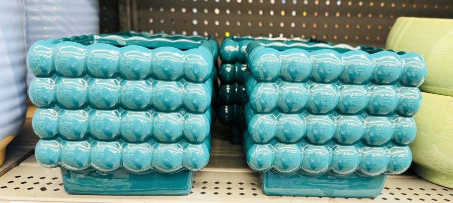 teal square bubble planters on store shelf