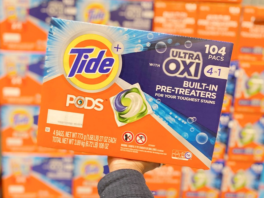 hand holding tide pods box 