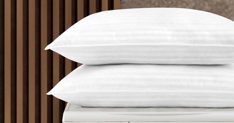 Two pillows on a washing machine 
