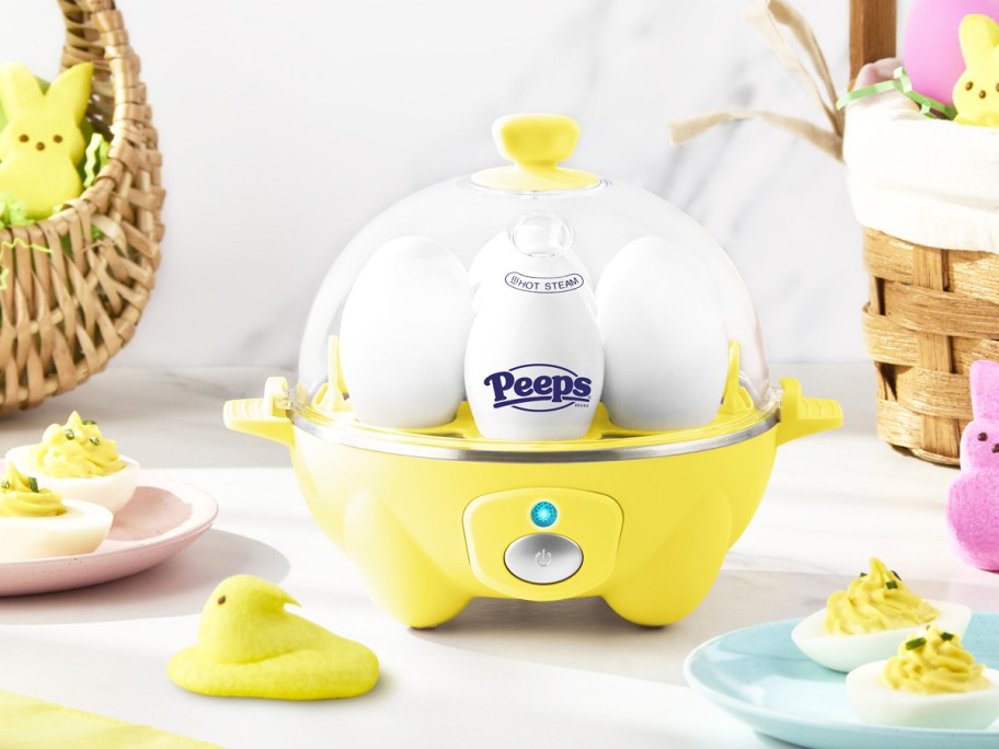 yellow egg cooker with easter peeps all around it
