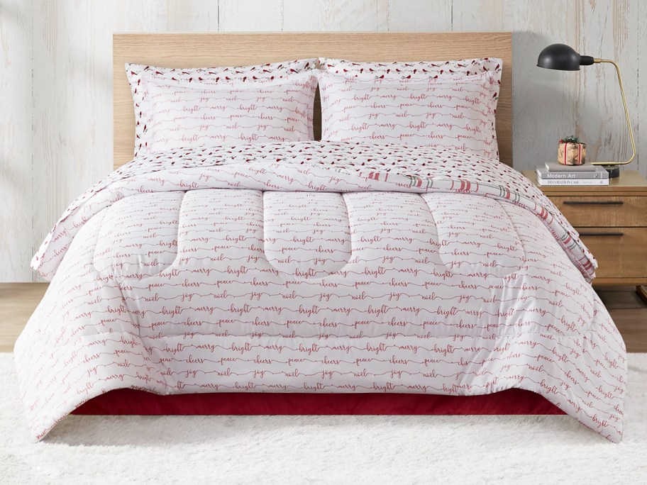 holiday printed comforter and shams on bed