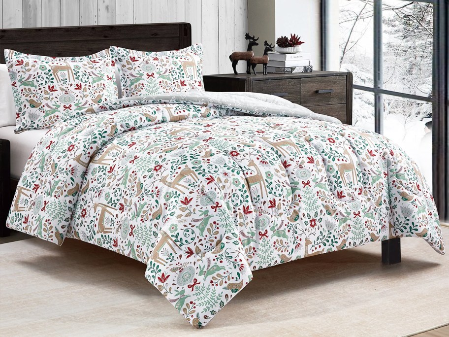 christmas print comforter and shams on bed