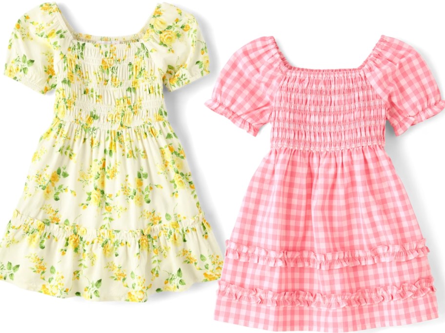 a girl's yellow floral dress and pink gingham dress