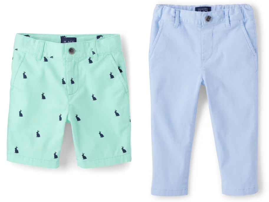 a pair of green shorts with blue bunnies and a pair of blue pants