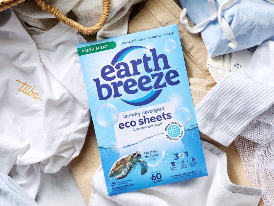 box of earth, breeze, fresh scent, laundry detergent, sheets on top of basket of laundry