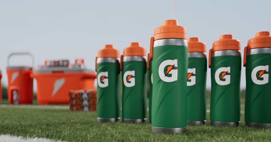 several gatorade water bottles on football field