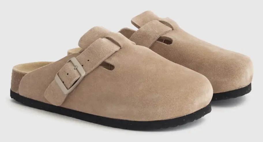 pair of light tan suede mules
