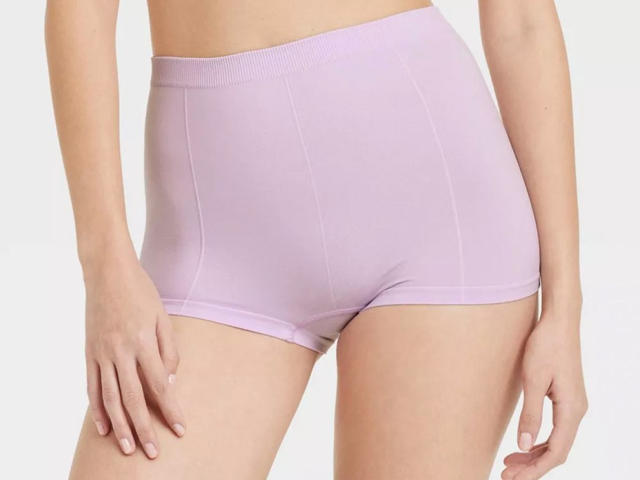 girl wearing purple boy shorts 