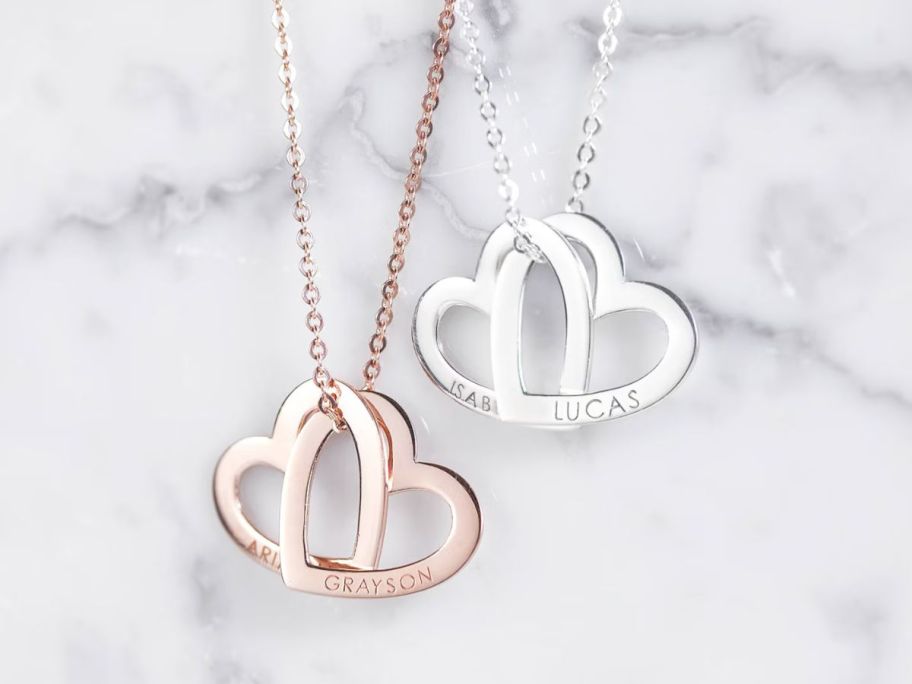 Two necklaces with hearts interlocked