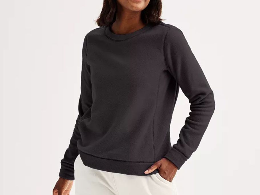 A woman wearing a black sweatshirt