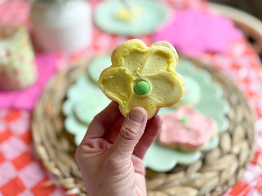 A person holding a Frosted Spring Cookie yellow