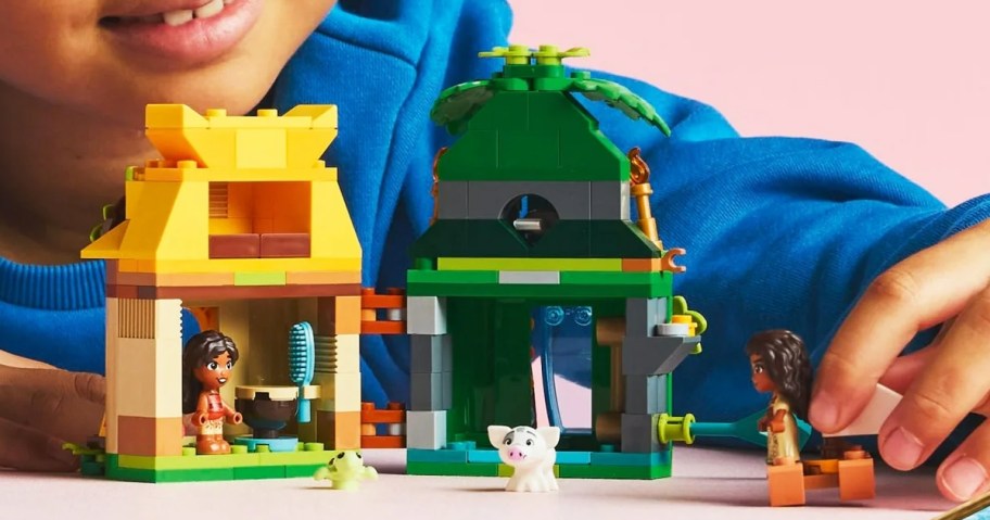 girl playing with LEGO Disney Moana's Island Fun set