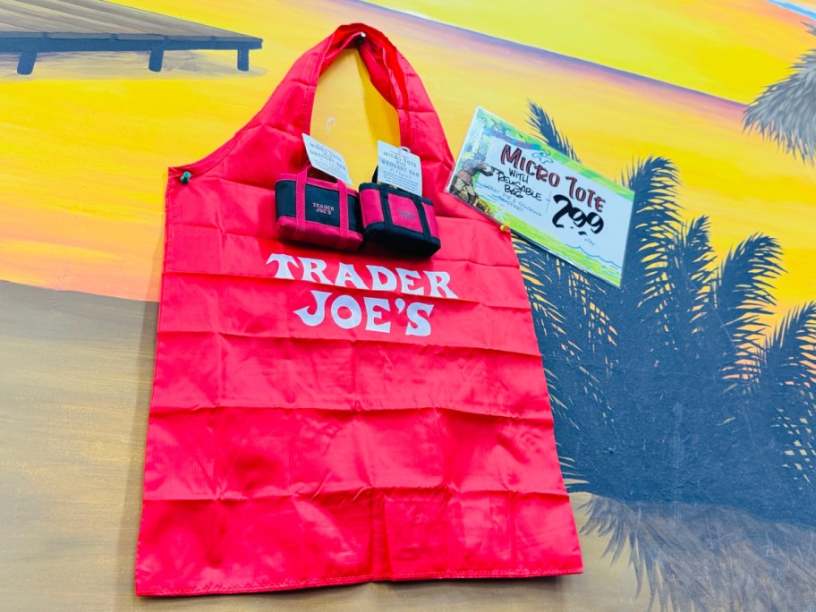 Trader Joe with shopping bag displayed on the outsdie