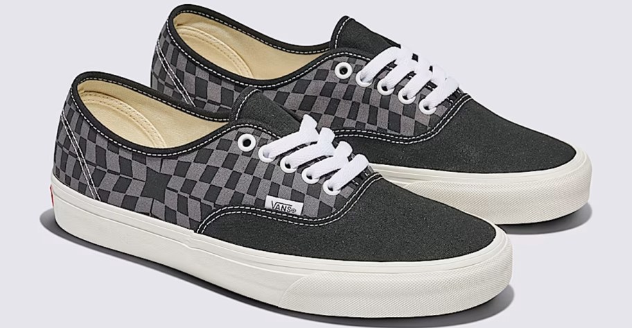 pair of black and grey checkerboard print sneakers